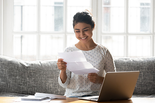 woman reading something and smiling